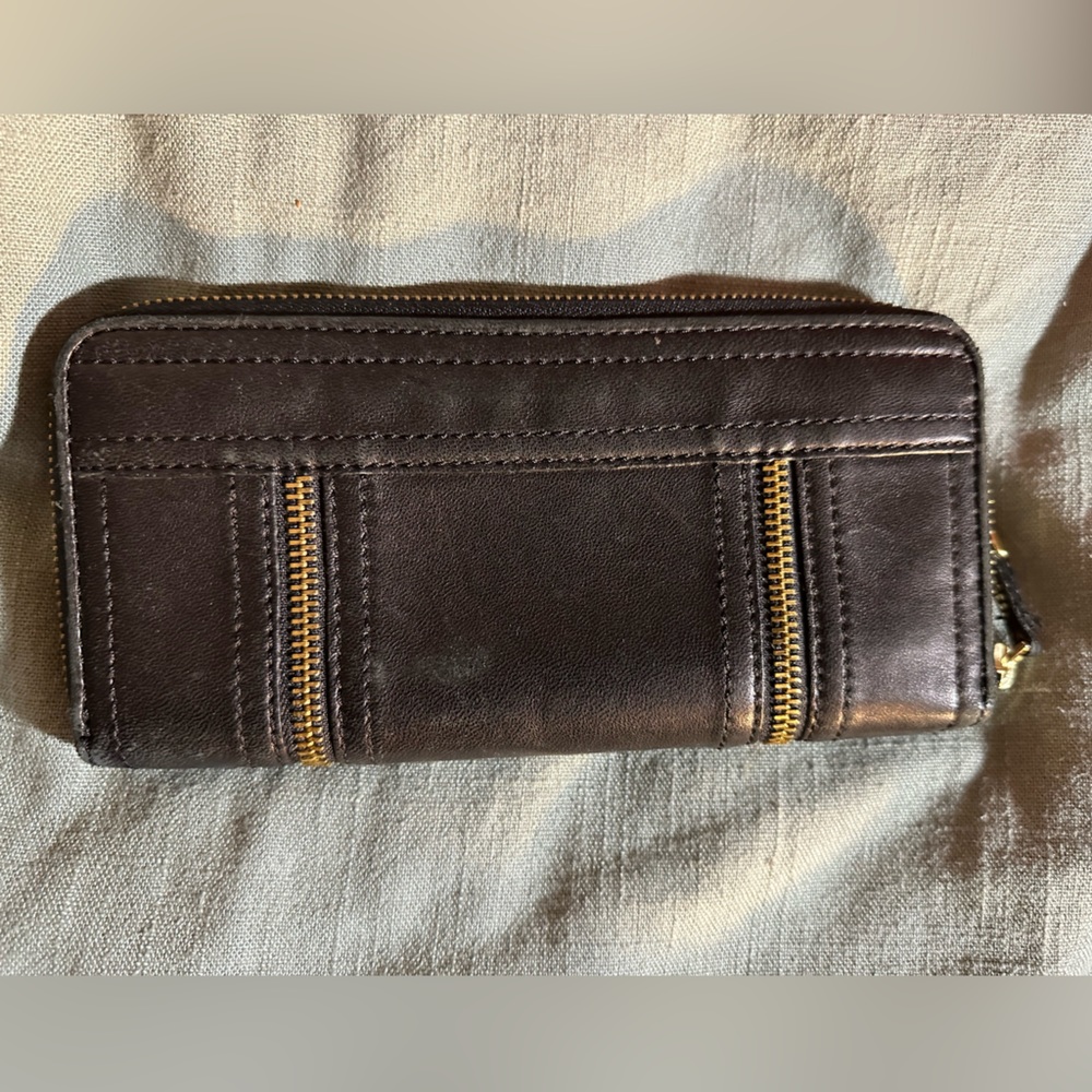 Used, but in good condition.  Black leather wallet